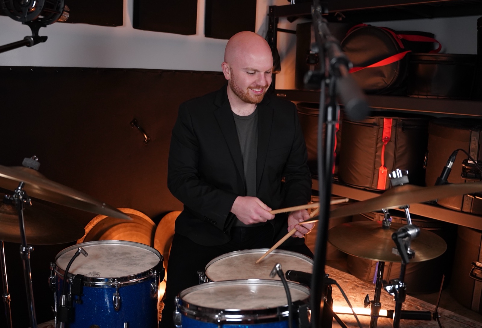 Ryan Shaw playing drums in the studio